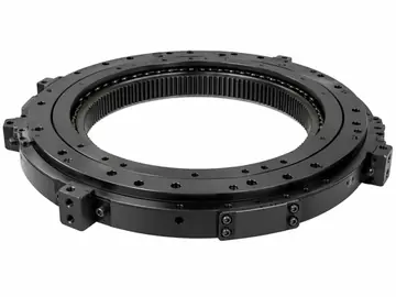 Low-profile black turret bearing ring with internal gear on white background